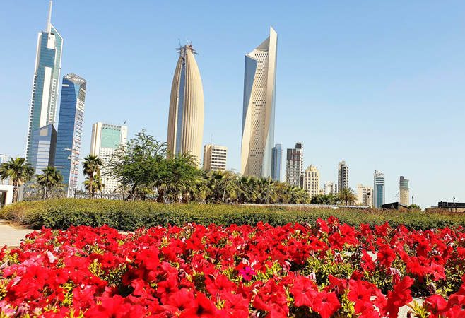 Nature scenery with view of skyscrapers inside of Al Shaheed Park