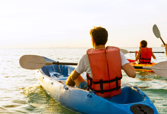 Kayaking at sunset by the sea in Kuwait