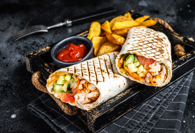 Shawarma with meat, vegetable salad and french fries
